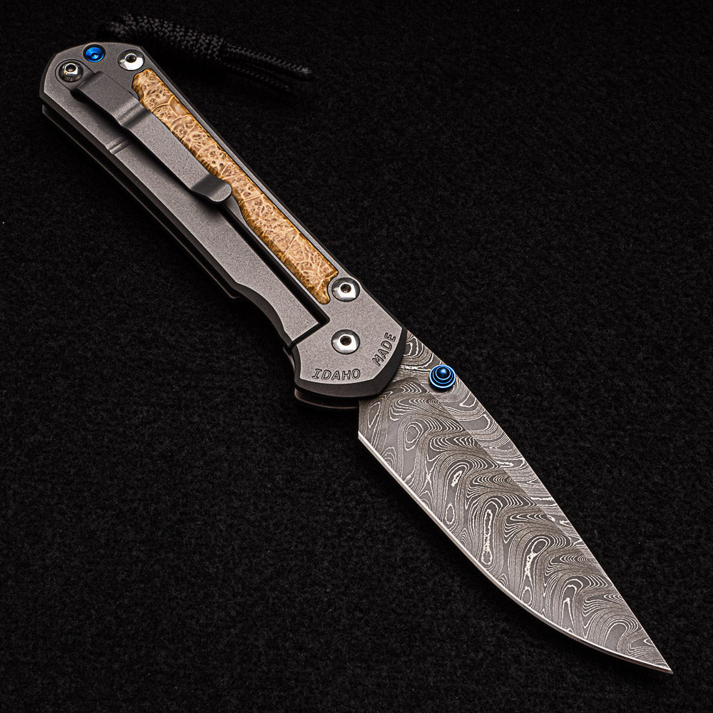 CHRIS REEVE LARGE SEBENZA 31 BOX ELDER BURL INLAY - BOOMERANG BLADE - BLUE DOUBLE THUMB LUGS