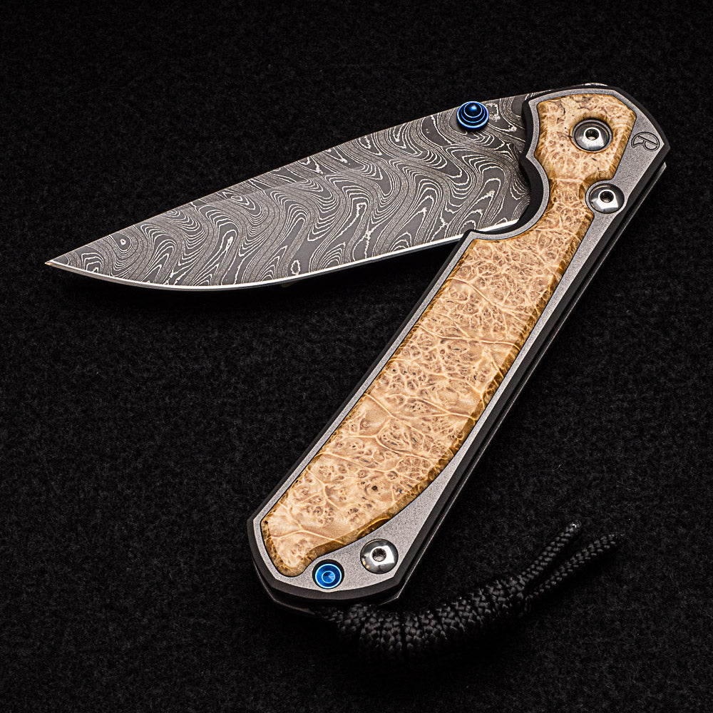 CHRIS REEVE LARGE SEBENZA 31 BOX ELDER BURL INLAY - BOOMERANG BLADE - BLUE DOUBLE THUMB LUGS