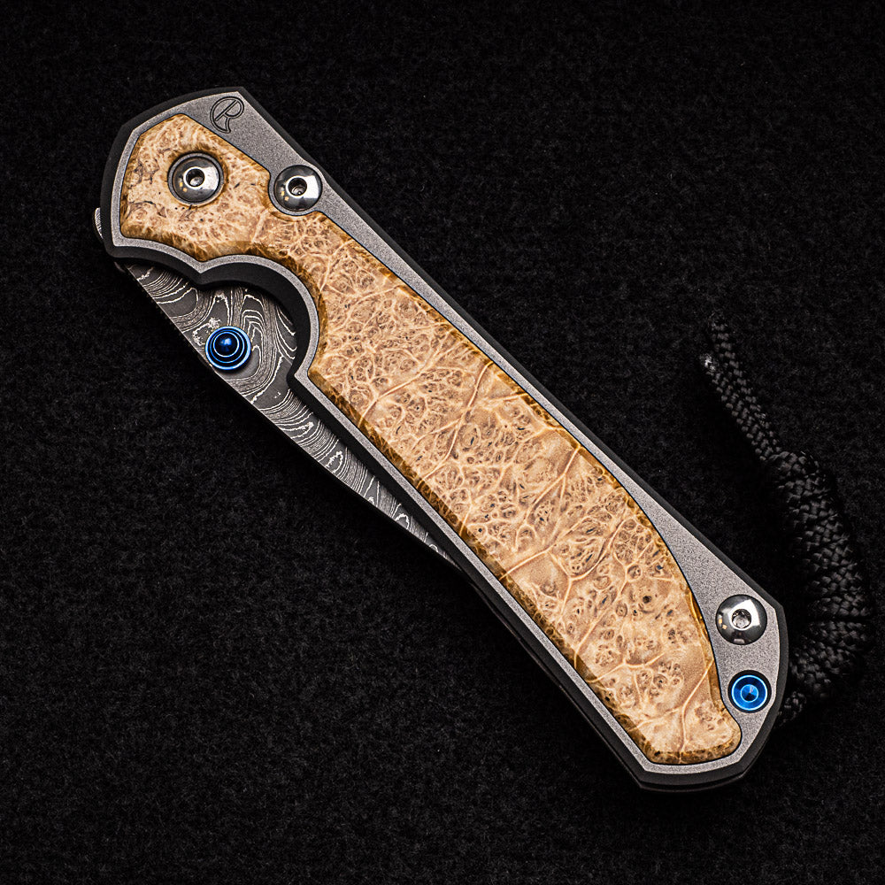 CHRIS REEVE LARGE SEBENZA 31 BOX ELDER BURL INLAY - BOOMERANG BLADE - BLUE DOUBLE THUMB LUGS