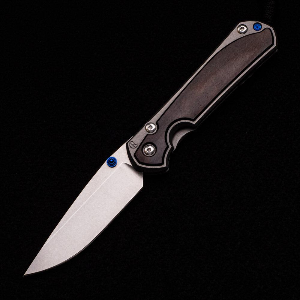 CHRIS REEVE LARGE SEBENZA 31 MACASSAR INLAY – CPM MAGNACUT BLADE – BLUE DOUBLE THUMB LUGS