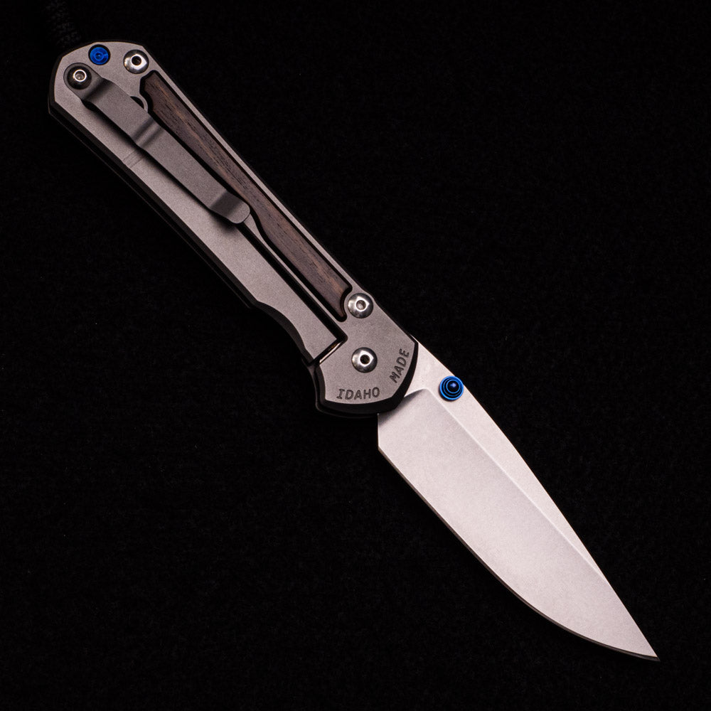 CHRIS REEVE LARGE SEBENZA 31 MACASSAR INLAY – CPM MAGNACUT BLADE – BLUE DOUBLE THUMB LUGS