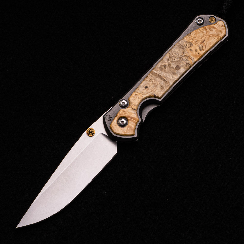 CHRIS REEVE LARGE SEBENZA 31 BOX ELDER BURL INLAY – CPM MAGNACUT BLADE – GOLD DOUBLE THUMB LUGS