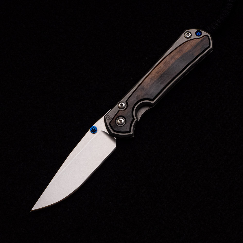 CHRIS REEVE SMALL SEBENZA 31 MACASSAR INLAY – CPM MAGNACUT BLADE – BLUE DOUBLE THUMB LUGS