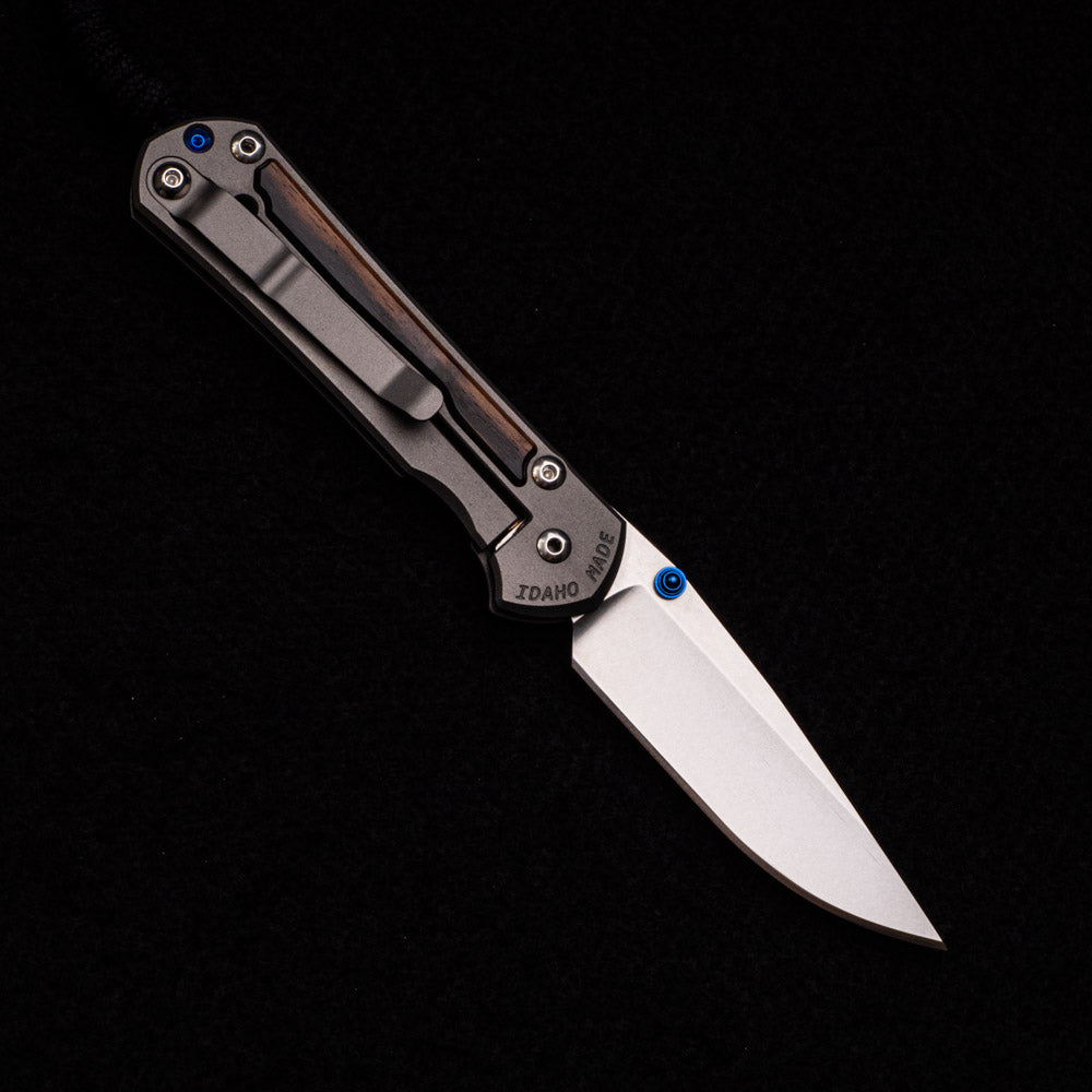 CHRIS REEVE SMALL SEBENZA 31 MACASSAR INLAY – CPM MAGNACUT BLADE – BLUE DOUBLE THUMB LUGS