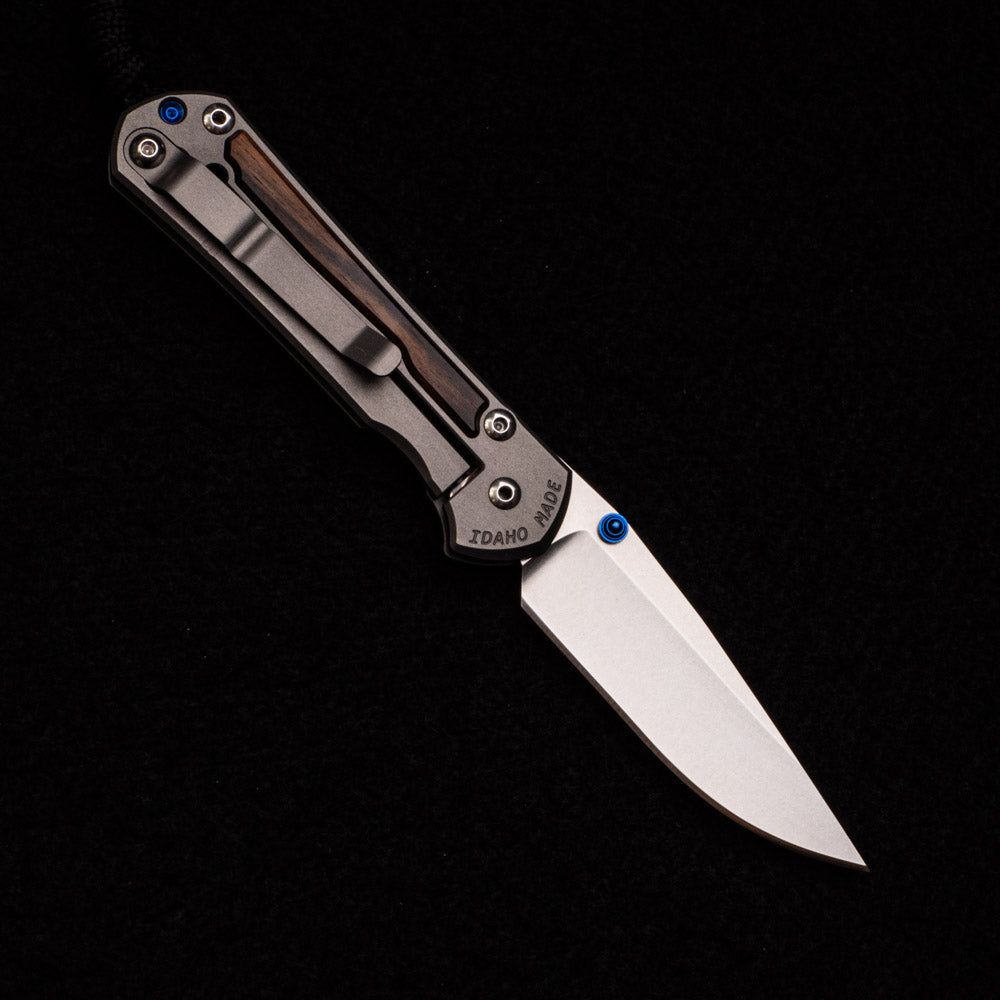 CHRIS REEVE SMALL SEBENZA 31 MACASSAR INLAY – CPM MAGNACUT BLADE – BLUE DOUBLE THUMB LUGS