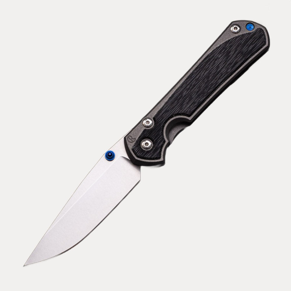 CHRIS REEVE LARGE SEBENZA 31 BLACK CANVAS MICARTA INLAY – CPM MAGNACUT BLADE – BLUE DOUBLE THUMB LUGS