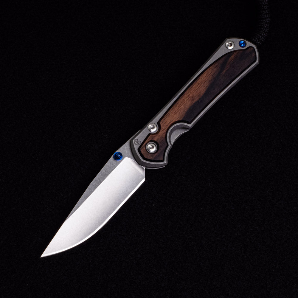 Chris Reeve Small Sebenza 31 – Macassar Ebony Inlays – CPM MagnaCut Blade – Blue Double Thumb Lugs