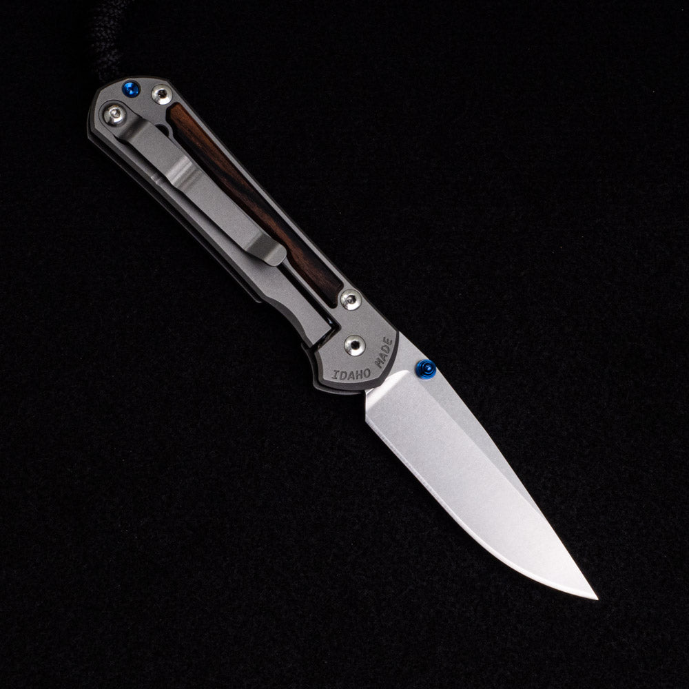 Chris Reeve Small Sebenza 31 – Macassar Ebony Inlays – CPM MagnaCut Blade – Blue Double Thumb Lugs