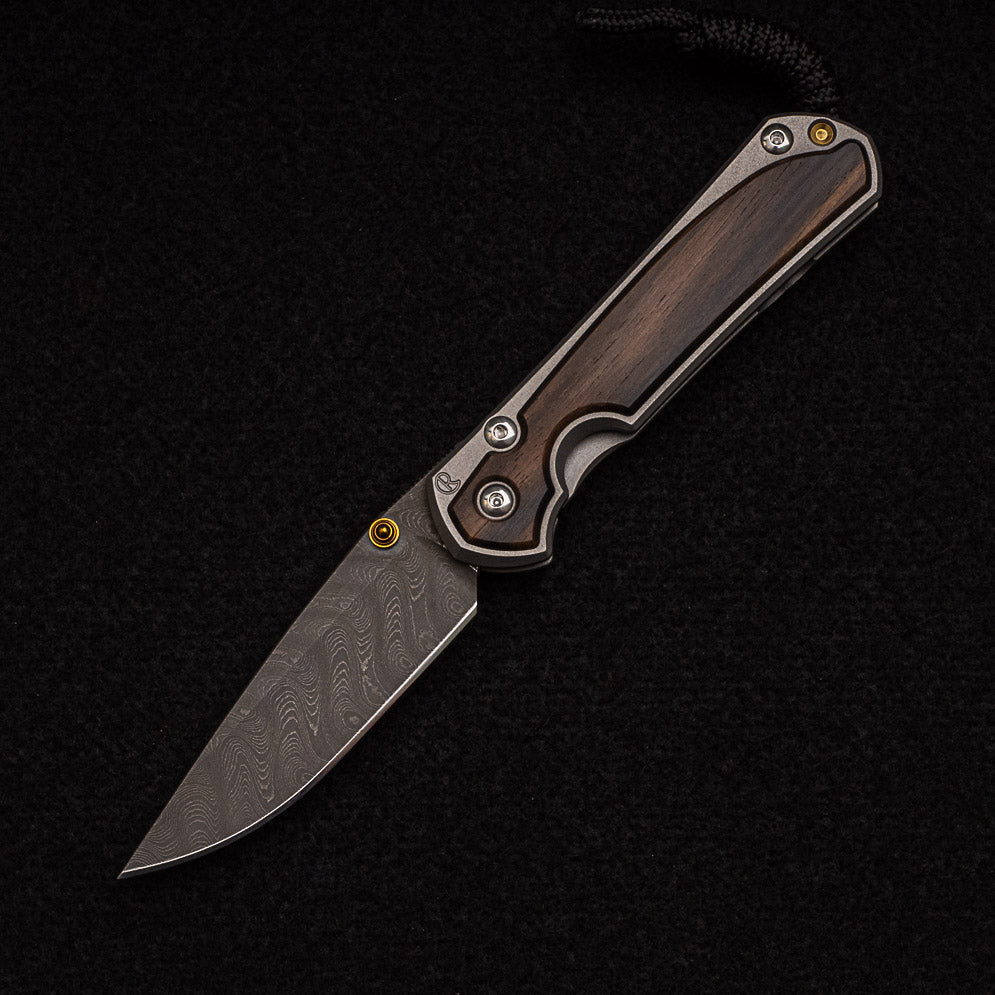 CHRIS REEVE SMALL SEBENZA 31 MACASSAR INLAY - BOOMERANG BLADE - GOLD DOUBLE THUMB LUGS