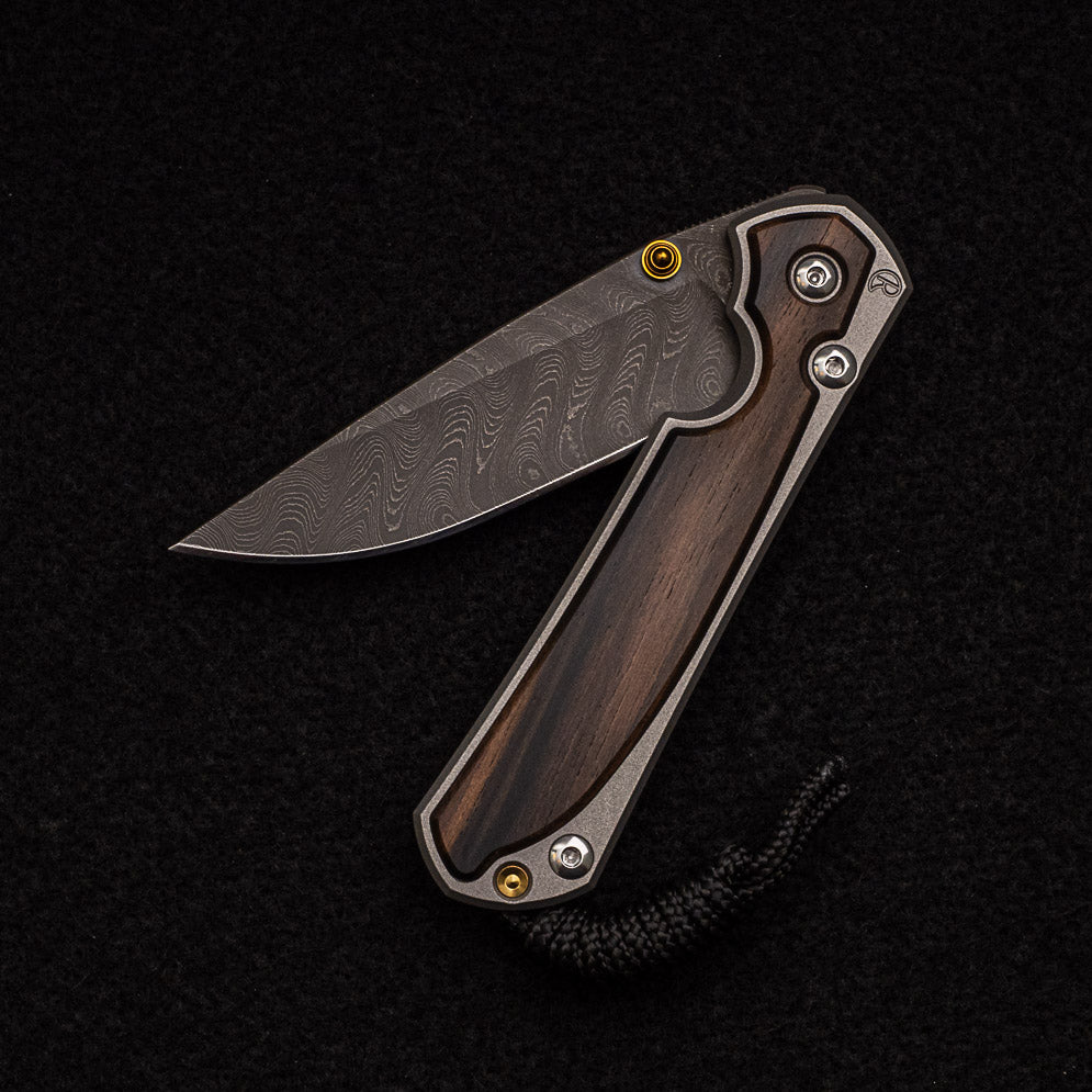 CHRIS REEVE SMALL SEBENZA 31 MACASSAR INLAY - BOOMERANG BLADE - GOLD DOUBLE THUMB LUGS