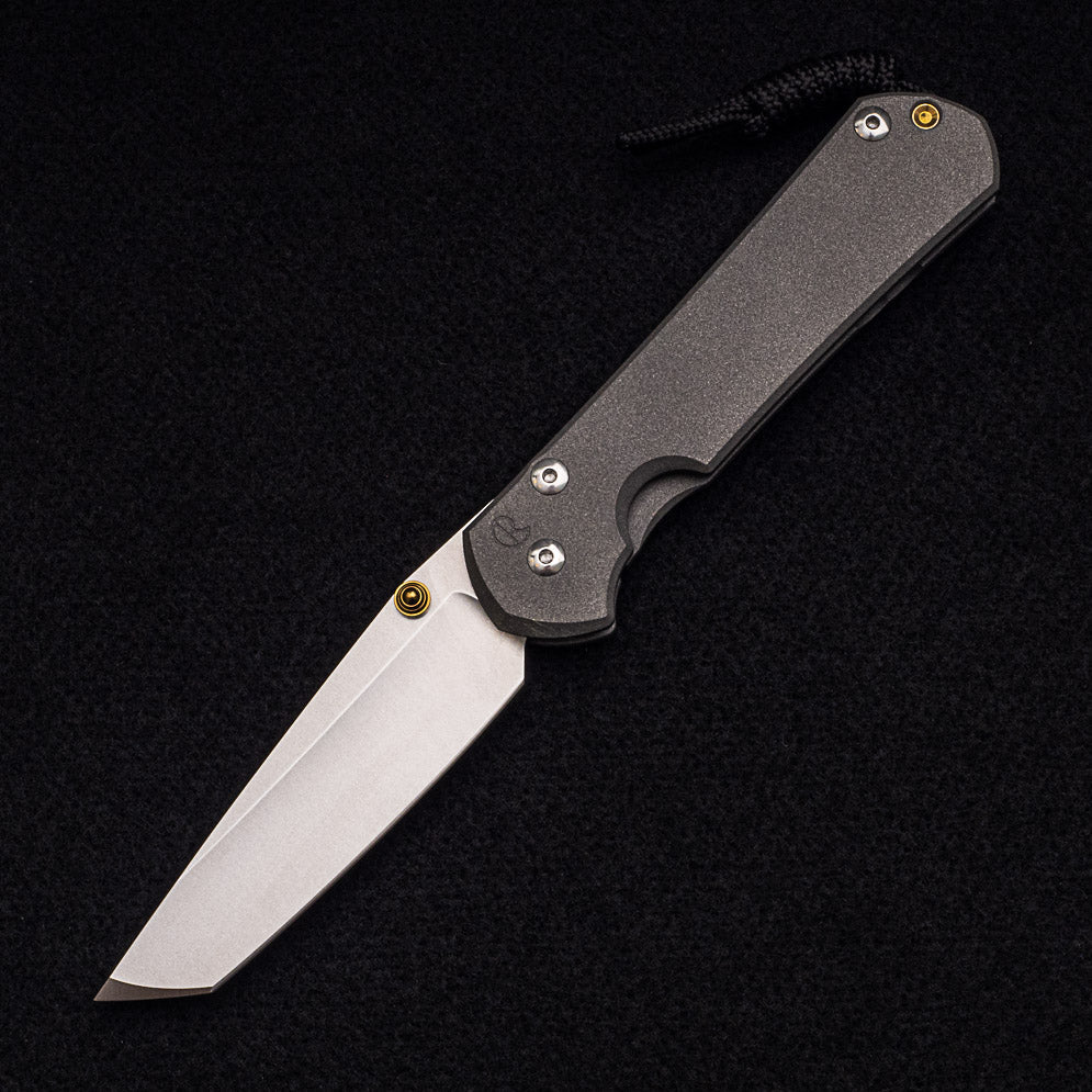 CHRIS REEVE LARGE SEBENZA 31 TANTO – GOLD DOUBLE THUMB LUGS – CPM MAGNACUT BLADE