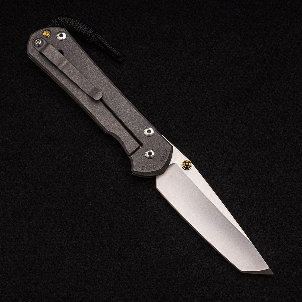 CHRIS REEVE LARGE SEBENZA 31 TANTO – GOLD DOUBLE THUMB LUGS – CPM MAGNACUT BLADE