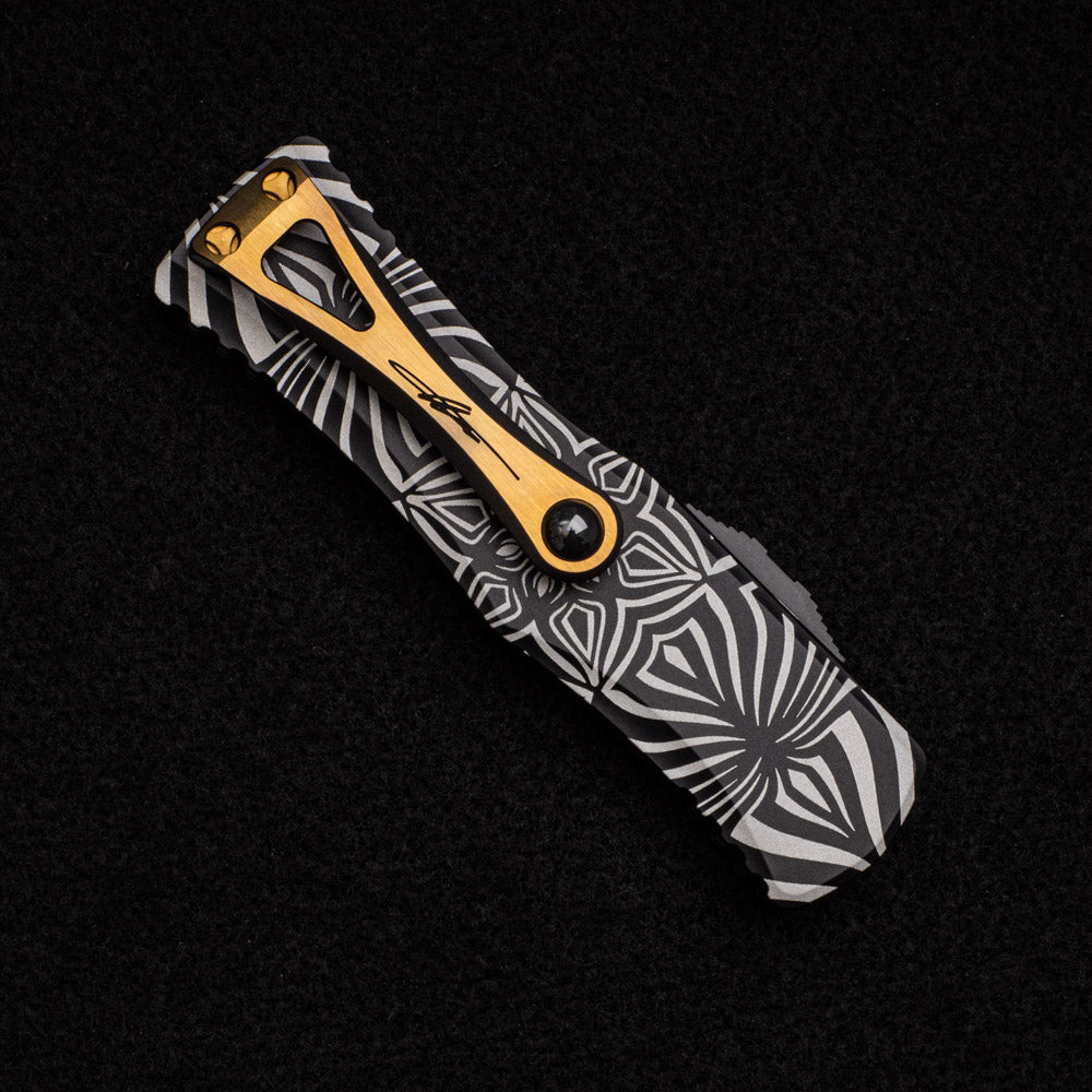 MICROTECH HERA S-E SIGNATURE SERIES – TWO-TONED BLACK W- GOLD ACCENTS ‘SOURCE’ ARTWORK 703-1TSOS