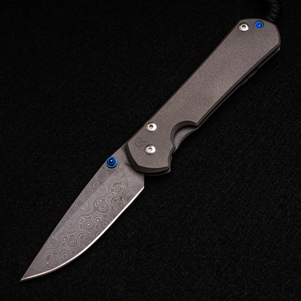 CHRIS REEVE LARGE SEBENZA 31 – BLUE DOUBLE THUMB LUGS – RAINDROP BLADE