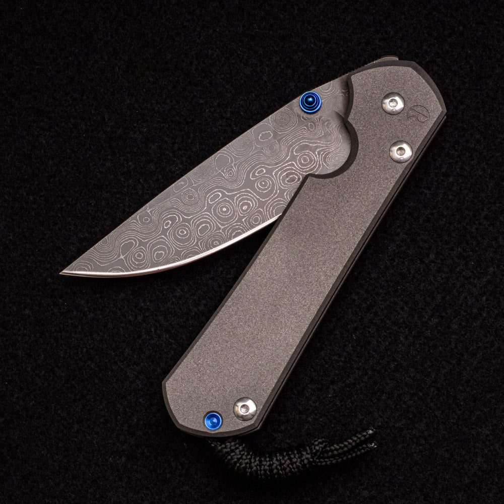 CHRIS REEVE LARGE SEBENZA 31 – BLUE DOUBLE THUMB LUGS – RAINDROP BLADE