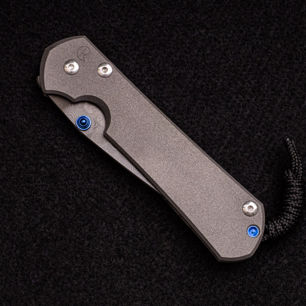 CHRIS REEVE LARGE SEBENZA 31 – BLUE DOUBLE THUMB LUGS – RAINDROP BLADE