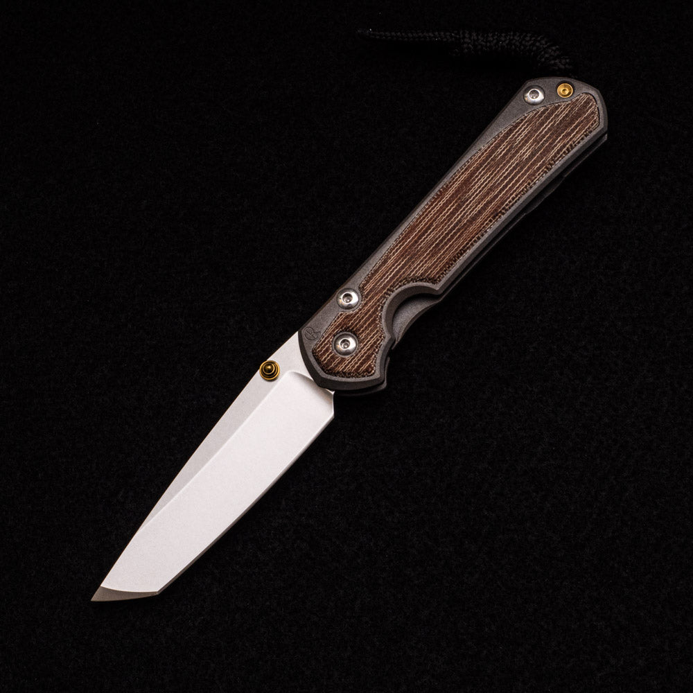 CHRIS REEVE SMALL SEBENZA 31 NATURAL CANVAS MICARTA INLAY – CPM MAGNACUT TANTO BLADE – GOLD DOUBLE THUMB LUGS