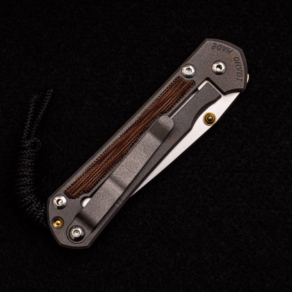 CHRIS REEVE SMALL SEBENZA 31 NATURAL CANVAS MICARTA INLAY – CPM MAGNACUT TANTO BLADE – GOLD DOUBLE THUMB LUGS