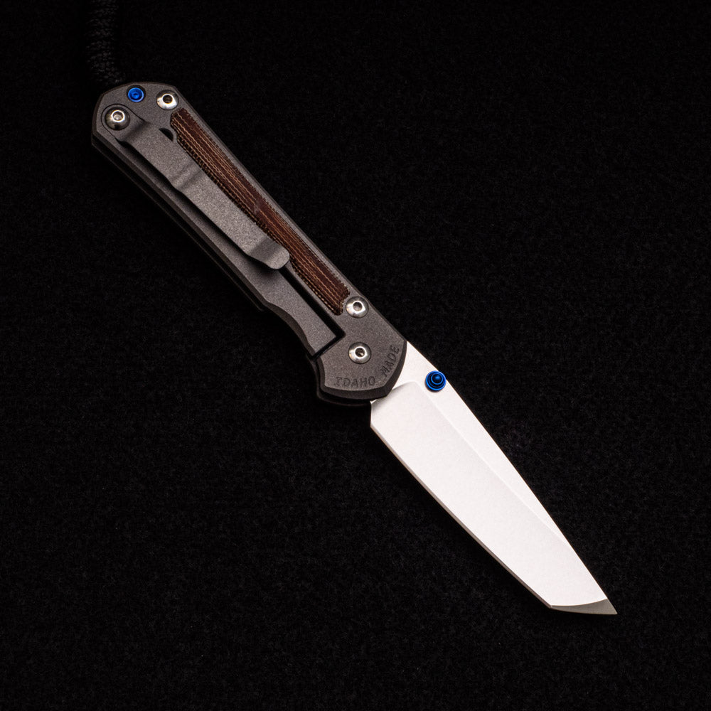 CHRIS REEVE SMALL SEBENZA 31 NATURAL CANVAS MICARTA INLAY – CPM MAGNACUT TANTO BLADE – BLUE DOUBLE THUMB LUGS