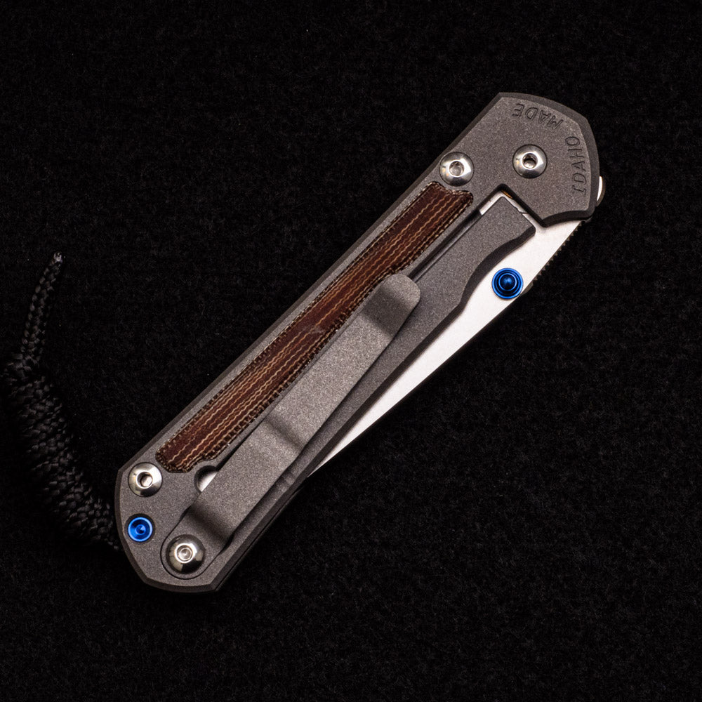 CHRIS REEVE SMALL SEBENZA 31 NATURAL CANVAS MICARTA INLAY – CPM MAGNACUT TANTO BLADE – BLUE DOUBLE THUMB LUGS