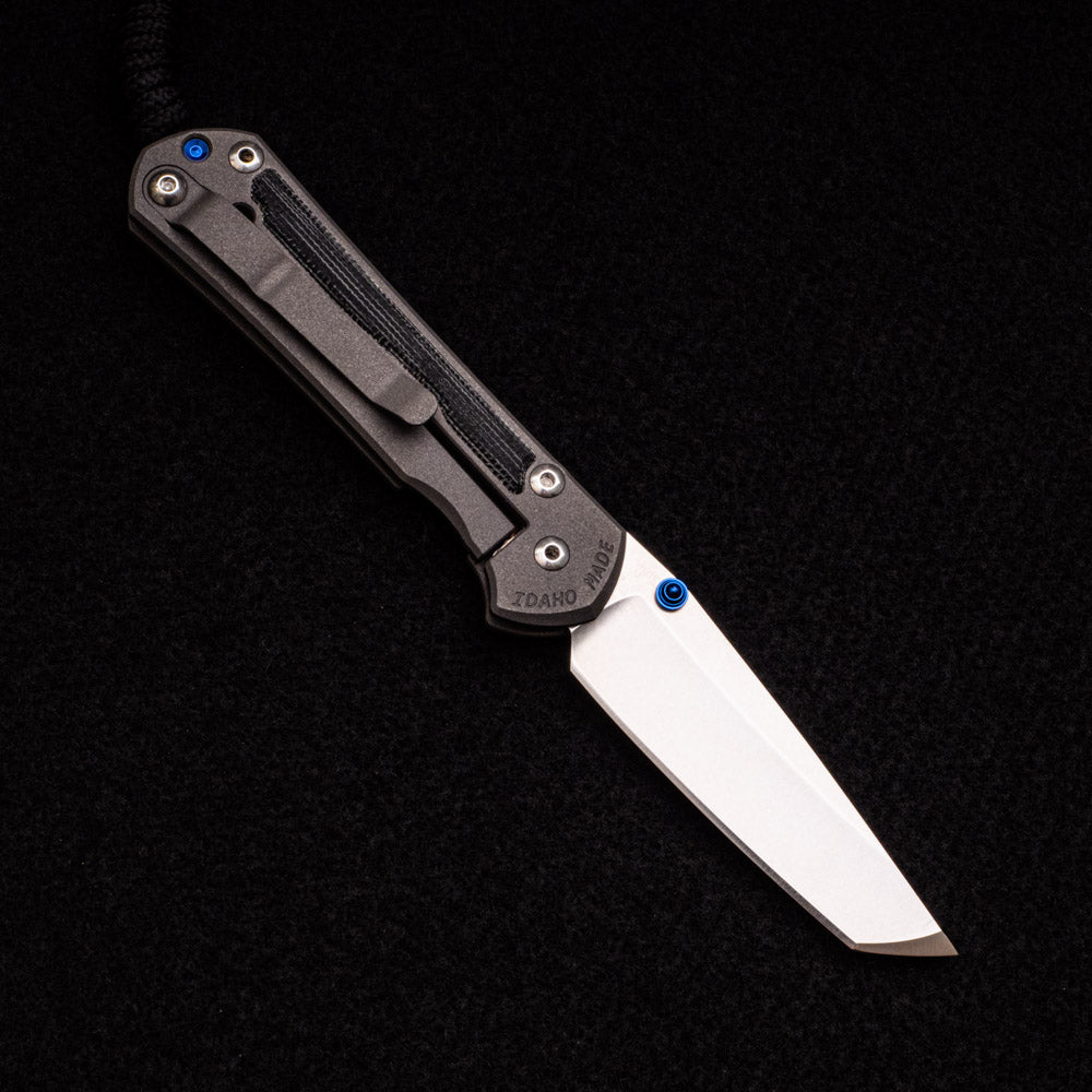 CHRIS REEVE SMALL SEBENZA 31 BLACK CANVAS MICARTA INLAY – CPM MAGNACUT TANTO BLADE – BLUE DOUBLE THUMB LUGS