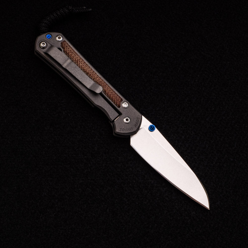 CHRIS REEVE SMALL SEBENZA 31 NATURAL CANVAS MICARTA INLAY – CPM MAGNACUT INSINGO BLADE – BLUE DOUBLE THUMB LUGS