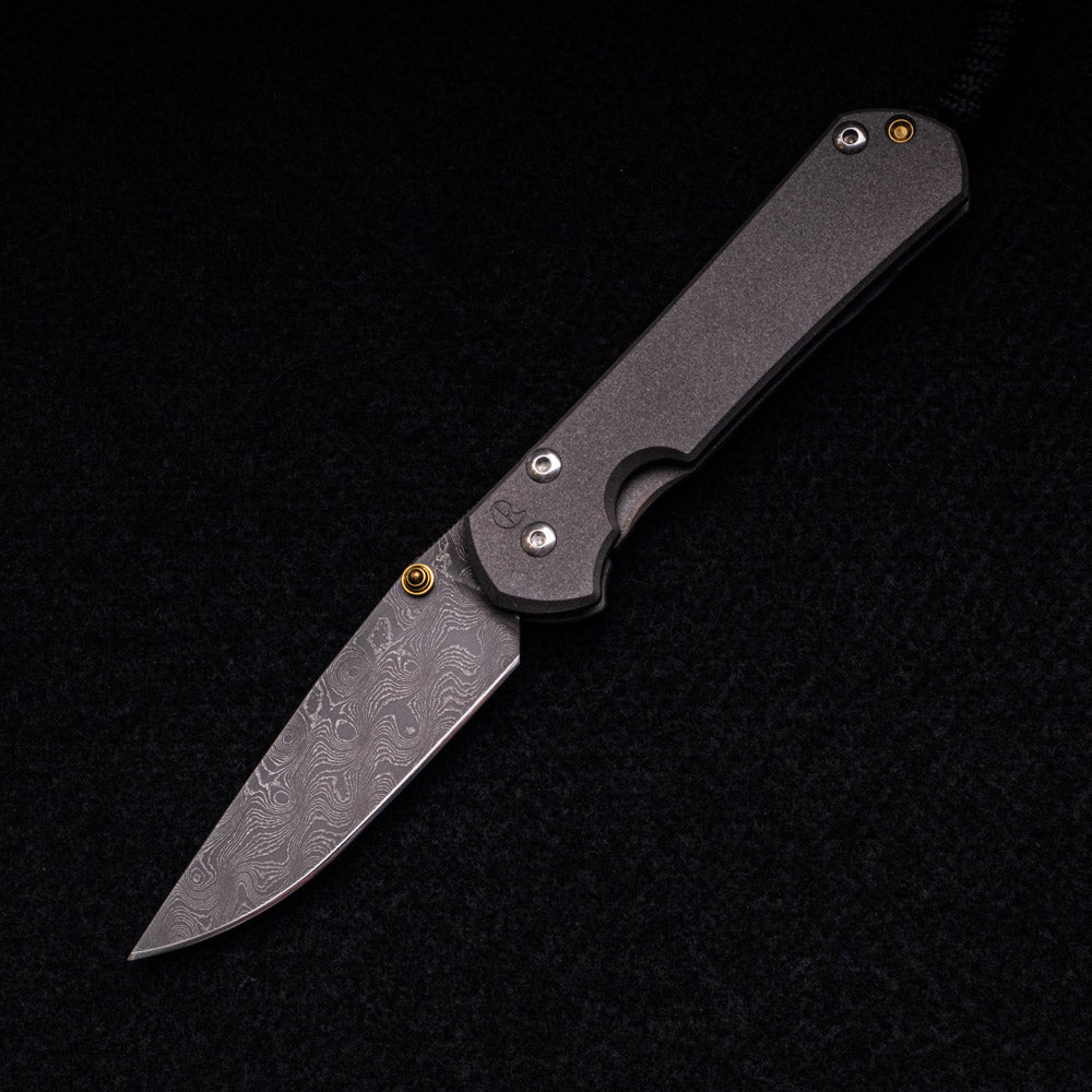 CHRIS REEVE SMALL SEBENZA 31 – RAINDROP BLADE – GOLD DOUBLE THUMB LUGS