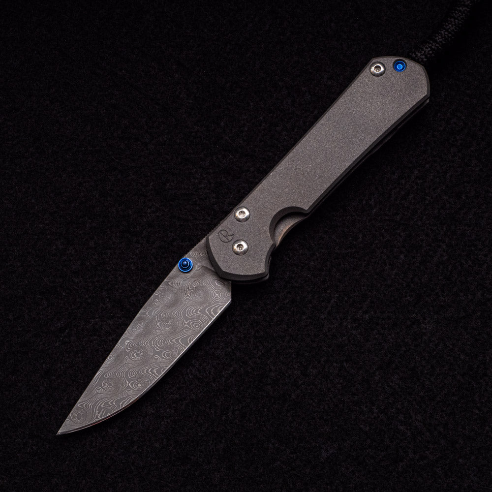 CHRIS REEVE SMALL SEBENZA 31 – BLUE DOUBLE THUMB LUGS – RAINDROP BLADE