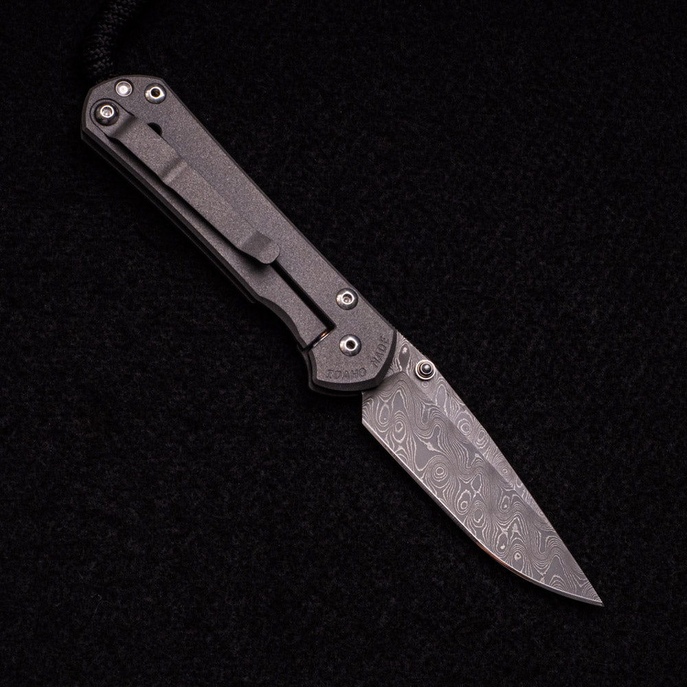 CHRIS REEVE SMALL SEBENZA 31 – SILVER DOUBLE THUMB LUGS – RAINDROP BLADE