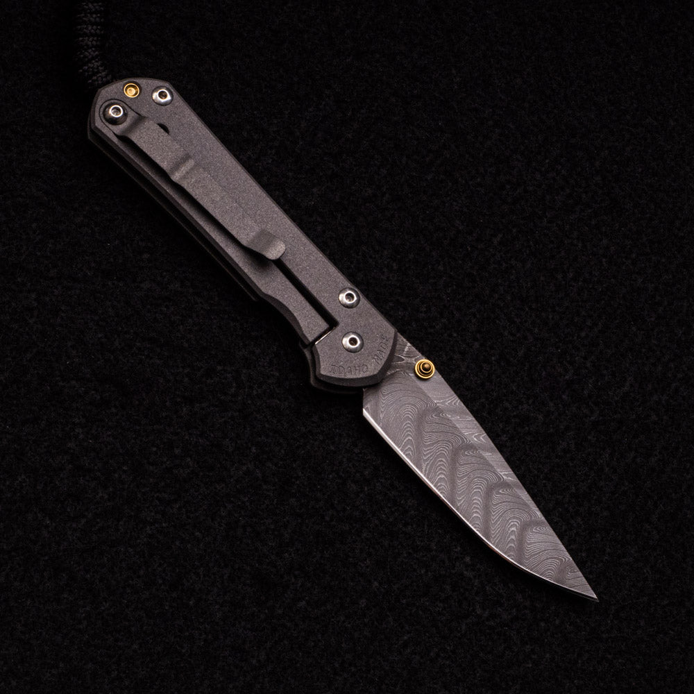 CHRIS REEVE SMALL SEBENZA 31 – GOLD DOUBLE THUMB LUGS – BOOMERANG BLADE