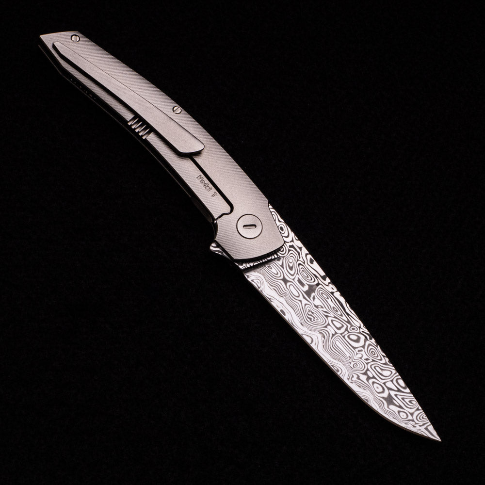 Hog House Knives Model T – Damasteel Blade – TI W- Silver – Black Micarta Inlay