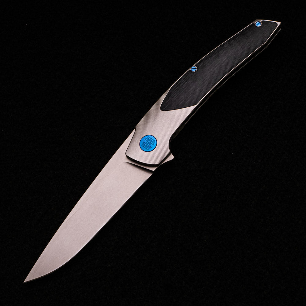 Hog House Knives Model T – RWL-34 Blade – TI W- Blue – Black Micarta Inlay