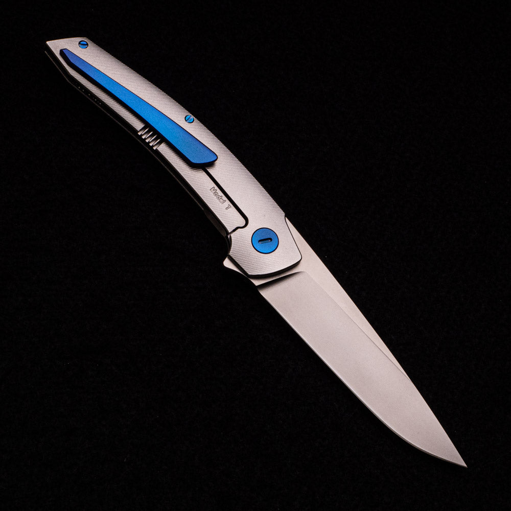 Hog House Knives Model T – RWL-34 Blade – TI W- Blue – Black Micarta Inlay