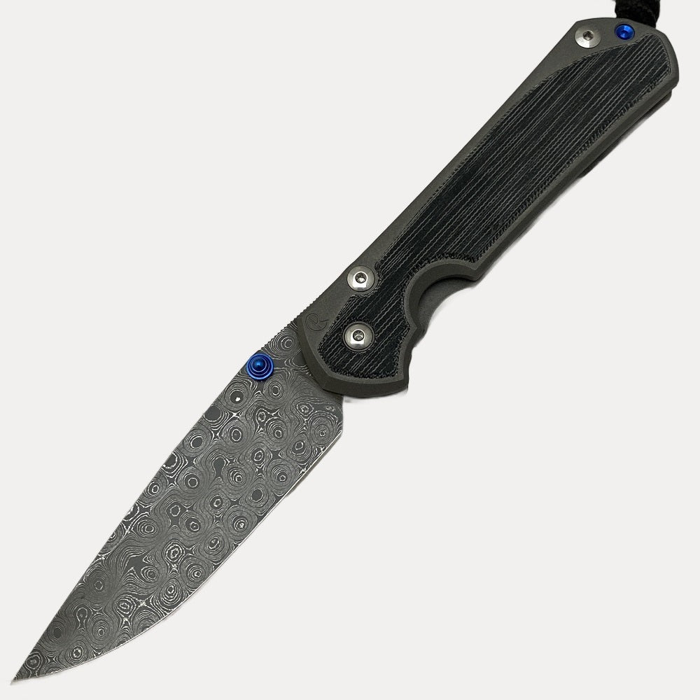 CHRIS REEVE LARGE SEBENZA 31 BLACK CANVAS MICARTA INLAY RAINDROP BLADE - BLUE DOUBLE THUMB LUGS