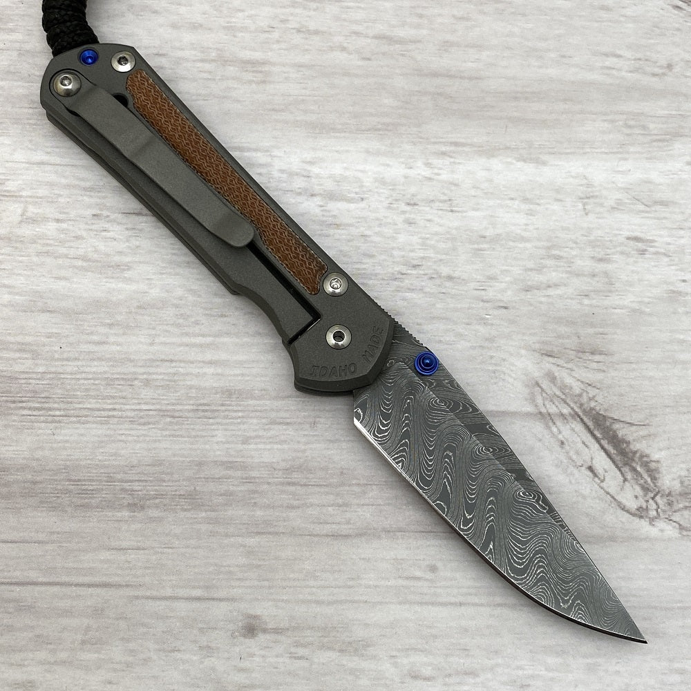 CHRIS REEVE SMALL SEBENZA 31 NATURAL CANVAS MICARTA INLAY - BOOMERANG BLADE - BLUE DOUBLE THUMB LUGS