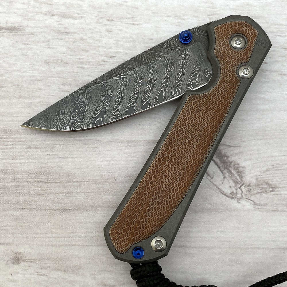 CHRIS REEVE SMALL SEBENZA 31 NATURAL CANVAS MICARTA INLAY - BOOMERANG BLADE - BLUE DOUBLE THUMB LUGS