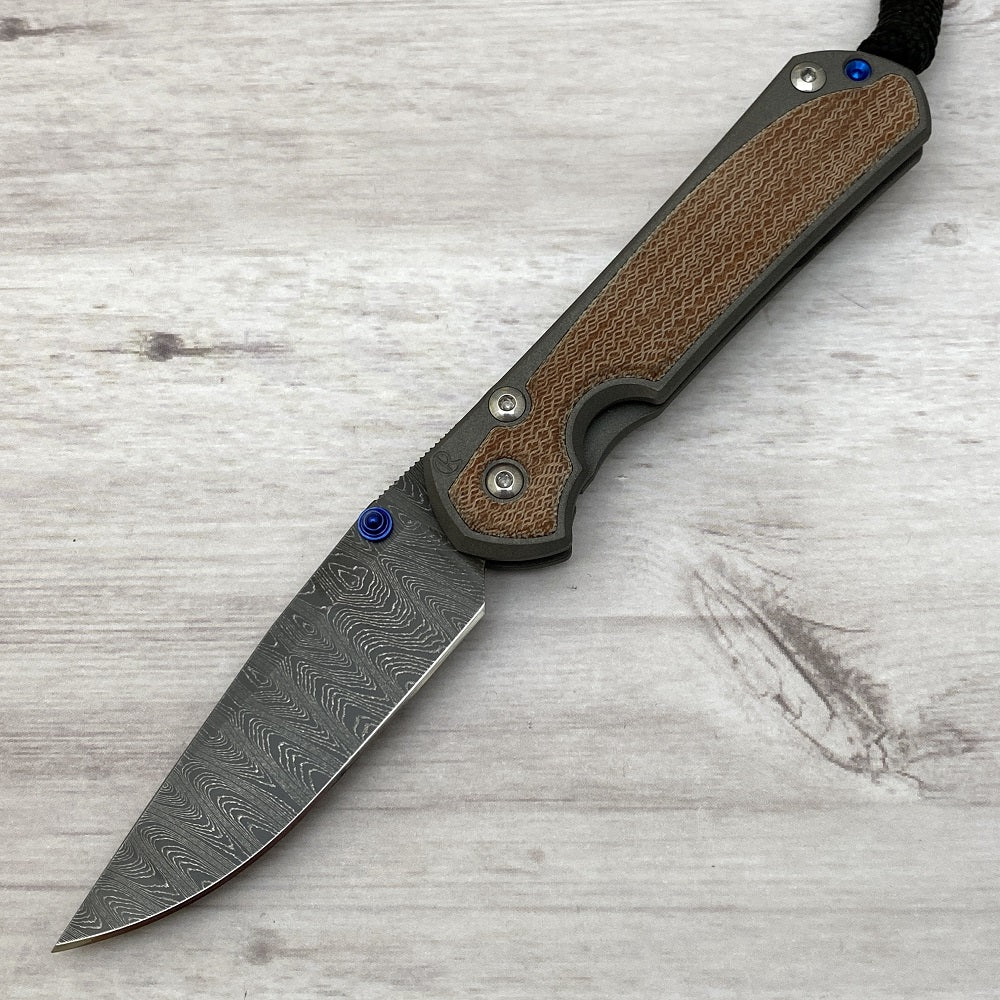 CHRIS REEVE SMALL SEBENZA 31 NATURAL CANVAS MICARTA INLAY - LADDER BLADE - BLUE DOUBLE THUMB LUGS