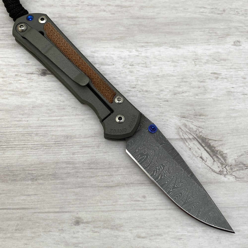 CHRIS REEVE SMALL SEBENZA 31 NATURAL CANVAS MICARTA INLAY - LADDER BLADE - BLUE DOUBLE THUMB LUGS