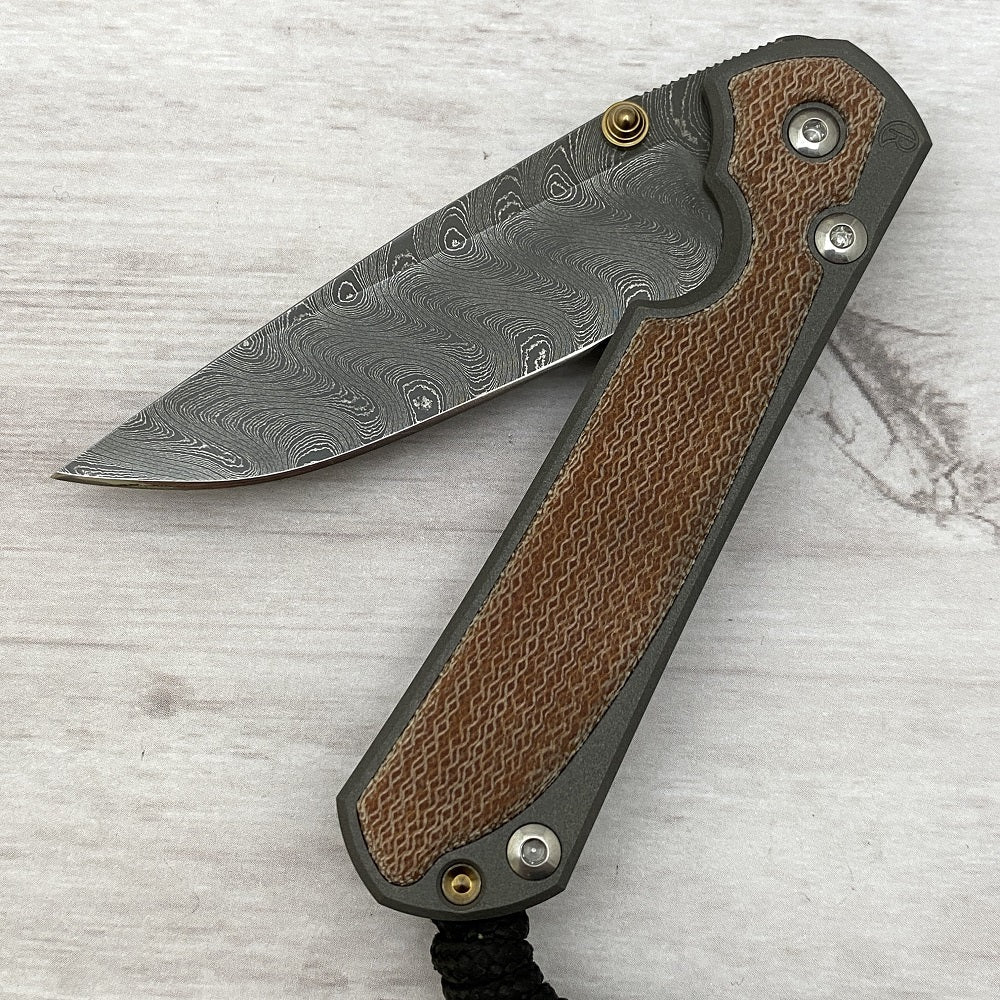 CHRIS REEVE SMALL SEBENZA 31 NATURAL CANVAS MICARTA INLAY - BOOMERANG BLADE - GOLD DOUBLE THUMB LUGS