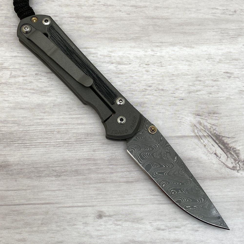 CHRIS REEVE SMALL SEBENZA 31 BLACK CANVAS MICARTA INLAY - BOOMERANG BLADE - GOLD DOUBLE THUMB LUGS