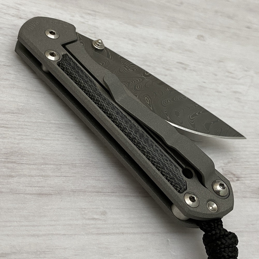 CHRIS REEVE SMALL SEBENZA 31 BLACK CANVAS MICARTA INLAY - BOOMERANG BLADE - SILVER DOUBLE THUMB LUGS