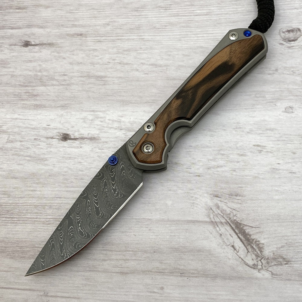 CHRIS REEVE SMALL SEBENZA 31 MACASSAR INLAY - BOOMERANG BLADE - BLUE DOUBLE THUMB LUGS