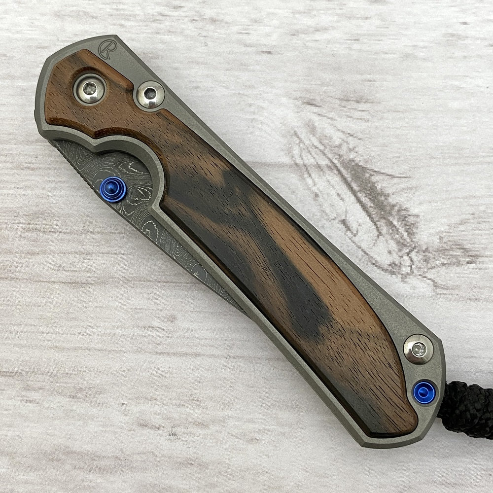 CHRIS REEVE SMALL SEBENZA 31 MACASSAR INLAY - BOOMERANG BLADE - BLUE DOUBLE THUMB LUGS