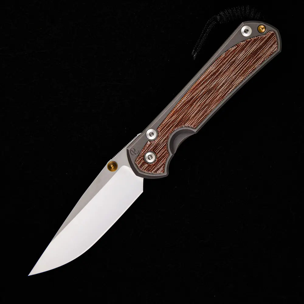 CHRIS REEVE LARGE SEBENZA 31 NATURAL CANVAS MICARTA INLAY – POLISHED CPM MAGNACUT BLADE – GLASS BLASTED – GOLD DOUBLE THUMB LUGS