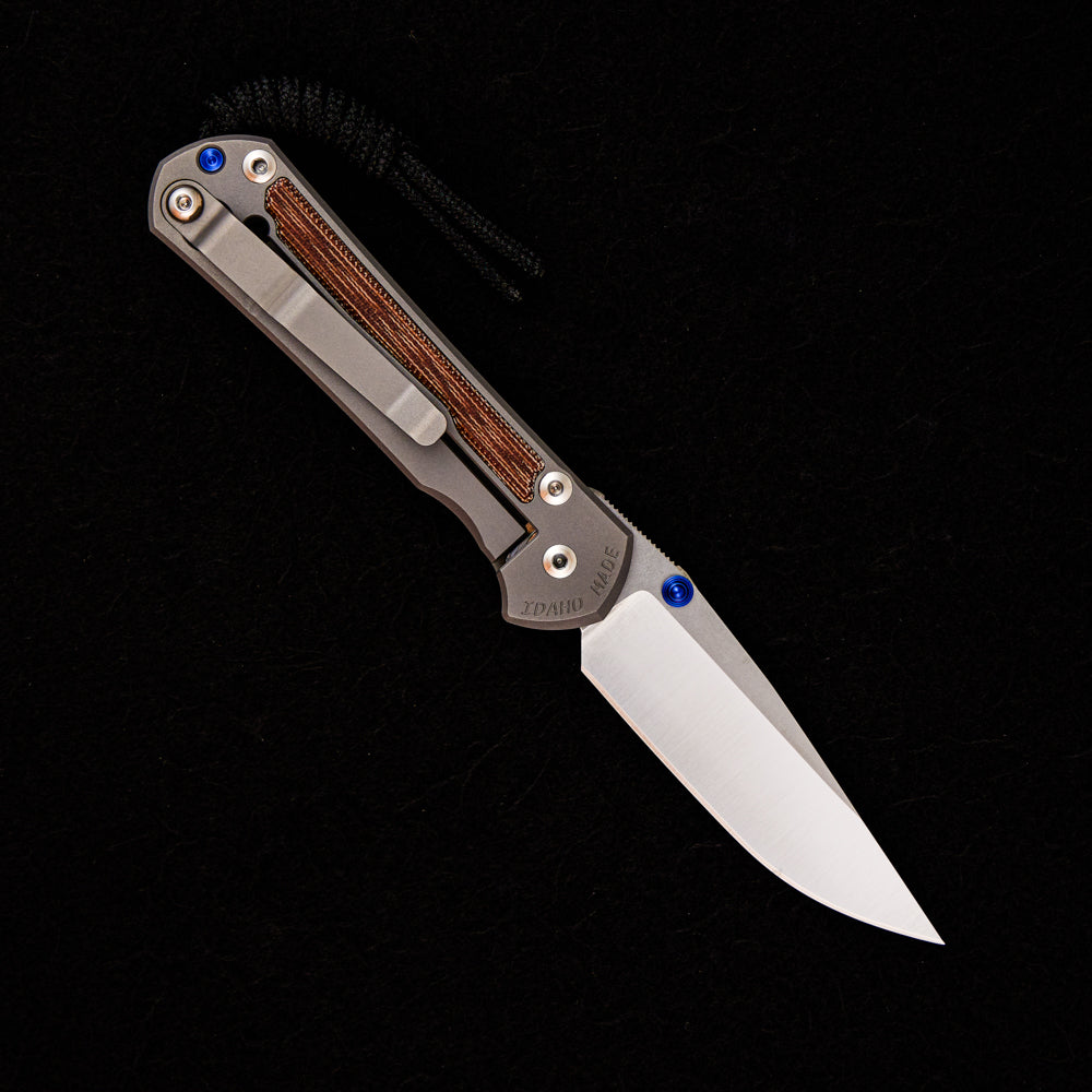 CHRIS REEVE SMALL SEBENZA 31 NATURAL CANVAS MICARTA INLAY – POLISHED CPM MAGNACUT BLADE – GLASS BLASTED – BLUE DOUBLE THUMB LUGS